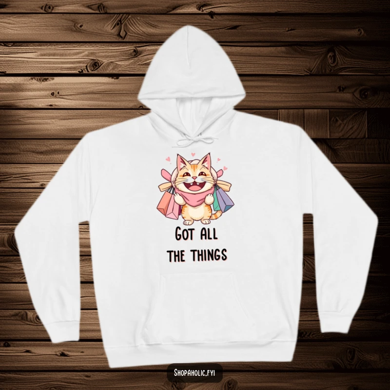 Funny hoodie showing a delighted cat buried under overflowing shopping bags, perfect for cat lovers who enjoy a good shopping spree.