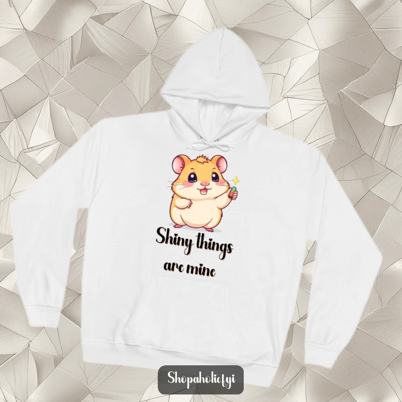 Funny hoodie displaying a cute, determined hamster reaching for a shiny treasure, symbolizing a humorous quest for glitter.