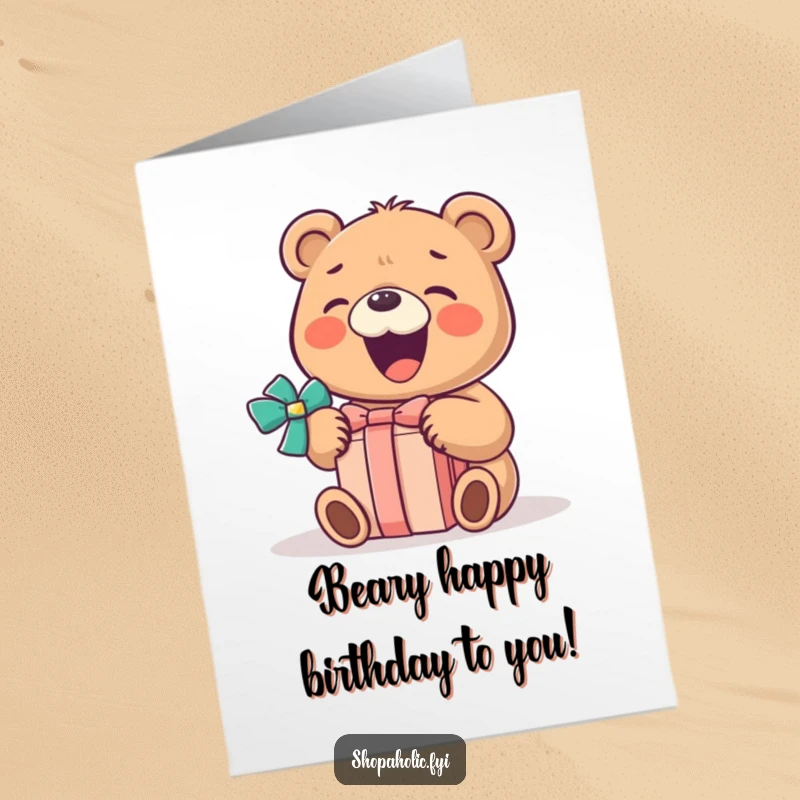 Funny free printable birthday card of a little bear with a huge smile, gleefully opening a wrapped present.