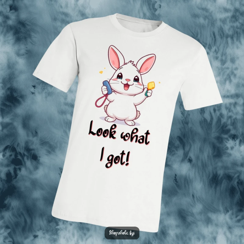 Funny T-Shirt: An ecstatic rabbit holds up a sparkly new accessory with pure delight, radiating a cheerful and humorous vibe.