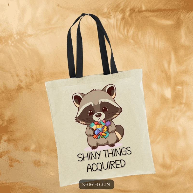 Funny tote bag with a raccoon holding a pile of small items, perfect for carrying essentials and showcasing a love for collecting.
